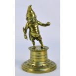 An early 20th century brass novelty lighter modelled as Mr Punch with cigar on a plinth, height 18.