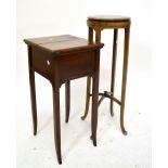 An Edwardian mahogany sewing table with twin hinged top, on square tapering outswept supports, 38.