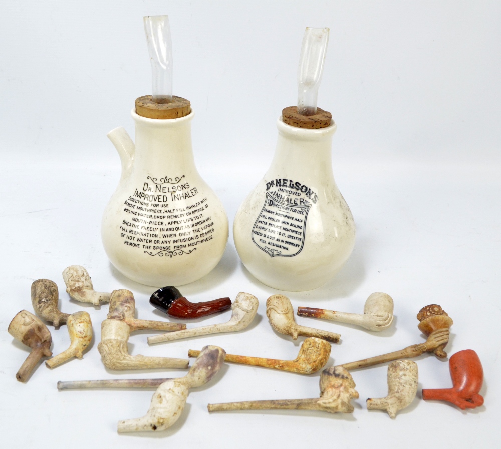 A small quantity of clay pipes of varied size and form to include examples with figural bowls,