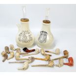 A small quantity of clay pipes of varied size and form to include examples with figural bowls,
