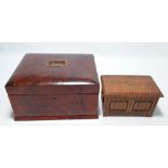 A Victorian mahogany simulated rosewood work box with central handle to the hinged lid enclosing