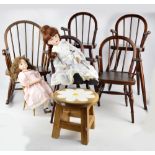 A group of mahogany doll's furniture comprising a pair of high chairs with spindle backs,