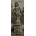 A composite garden statue of a small girl in shy pose,