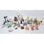 A collection of over twenty ceramic model cats of varied size and form to include Royal Doulton