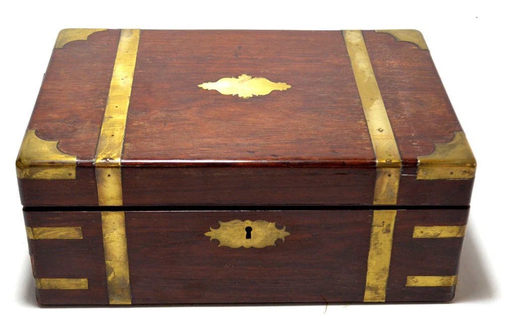 A Victorian mahogany cased brass bound writing slope with gilt tooled navy leather and fitted