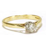 An 18ct yellow and white gold diamond solitaire ring,