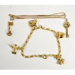 A 9ct yellow gold child's charm bracelet suspending four charms to include a teddy bear and a heart,