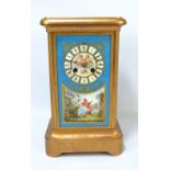 A French brass and Sèvres style porcelain panel decorated eight day mantel clock,