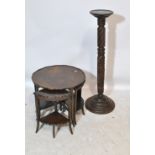 A mahogany torchère stand and a nest of occasional tables.