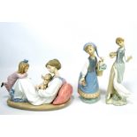 A boxed Lladro figure group depicting mother with child and newborn baby, width approx 23cm,