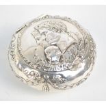 A 19th century Dutch silver circular snuff box embossed with bust of Emperor Napoleon and his