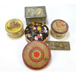 A collection of buttons contained in five vintage tins.