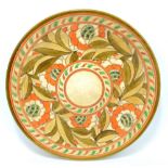 CHARLOTTE RHEAD; a Crown Devon circular plate with floral tubeline decoration,