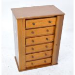 A six drawer table top collector's cabinet, with Wellington locking mechanism, height 42cm.