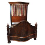 A Victorian mahogany half tester bed of serpentine outline with canopy and rail,