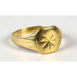 A 9ct yellow gold gentleman's signet ring with bright cut decoration, size Y, approx 4.8g.