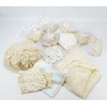 A quantity of linen to include lace serviettes, embroidered table cloths, etc.