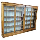 A pair of early 20th century oak display cabinets,