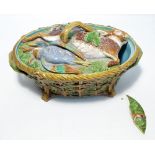 A Mintons style game pie dish in the form of a basket with foliate handles,