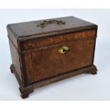 A 19th century oak three section tea caddy with brass loop handle to top on bracket feet, width 27.