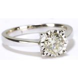 An 18ct white gold illusion set diamond solitaire ring,