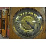 An early 20th century oak cased two weight chiming longcase clock,