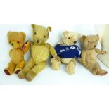 Nine early 20th century teddy bears to include a blonde mohair example with glass eyes,