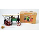 A boxed Mamod Steam Tractor TE1a in cream and green livery with red detail, with scuttle,