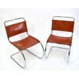 A set of four chrome tubular and brown leather chairs,