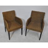 A set of six Lloyd Loom wicker elbow dining chairs on tapered square supports,