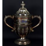 A large silver plated twin handled trophy cup and cover with acanthus scroll loop handles,