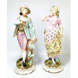 A pair of large Continental porcelain figures of man with rifle leaning against a tree stump (af),