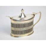 HASELER BROS; an Edward VII hallmarked silver mustard pot of oval form with pierced sides,