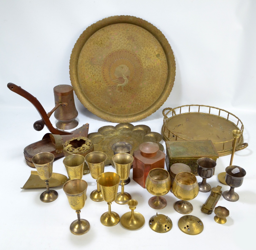 A small group of metalware to include a set of brass goblets, an Eastern cylindrical box,