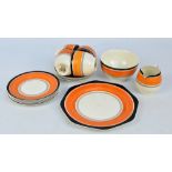 A Gray's hand painted orange and black five setting part coffee set comprising four coffee cups and