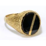 A 9ct yellow gold gentleman's signet ring set with oval vacant black onyx cartouche, size T1/2,