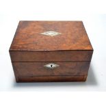 A Victorian figured walnut vanity box with mother of pearl inlaid lozenge and vacant cartouche to