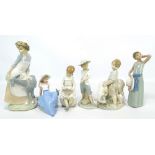A Lladro figure, four Nao figures and another (6).