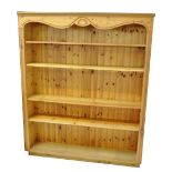 A large modern pine bookcase with moulded cornice above four adjustable shelves, width 158cm.