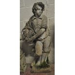 A well modelled composite garden statue modelled as a young boy with a basket of grapes leaning