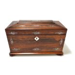 A William IV rosewood tea caddy of sarcophagus form with mother of pearl inlaid stylised floral