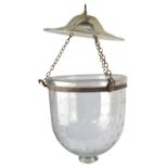 An etched clear glass bell shaped storm lantern with metal trim,