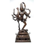A late 19th/early 20th century Indian bronze figure of Shiva on double lotus and rectangular base,