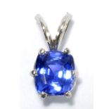 A 14ct white gold and natural tanzanite pendant, the cushion shaped stone weighing 1.5ct, approx 1.