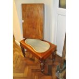 A 19th century mahogany bidet, the rectangular top enclosing an enamel liner, on turned supports,