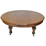 A Victorian oval oak dining table on bulbous turned supports to castors, length 159.5cm.