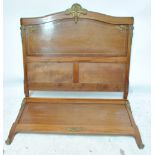 A French mahogany and brass mounted head board and foot board, width 141cm, no side or base slats.