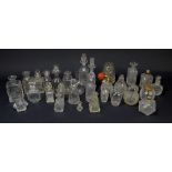 A collection of clear glass scent bottles of varied form and size, also one atomiser,