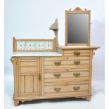 A late Victorian satin walnut washstand with part marble top and ceramic tile decoration over one