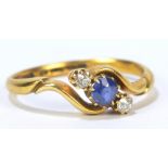 An 18ct yellow gold three stone dress ring, ring size R, approx 3.5g.